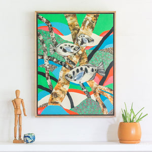 Original Artwork, by Rachel Ireland Meyers, titled "Take Aim, Archerfish." This artwork, is colourful with greens and blues and pink and orange. It has 3 fish with black spots amongst mangroves. 